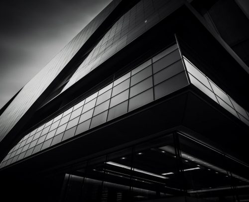 futuristic-skyscraper-steel-glass-illuminated-night-generated-by-ai